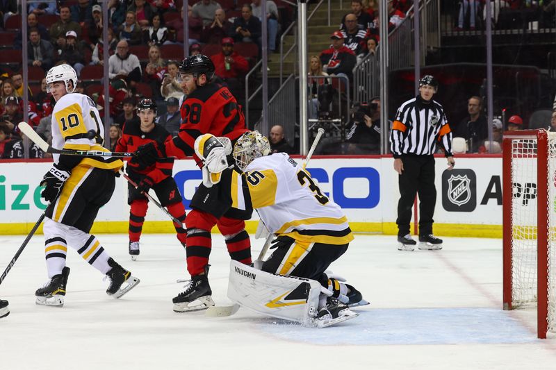 Mar 19, 2024; Newark, New Jersey, USA; New Jersey Devils right wing Timo Meier (28) scores a goal on Pittsburgh Penguins goaltender Tristan Jarry (35) during the second period at Prudential Center. Mandatory Credit: Ed Mulholland-USA TODAY Sports