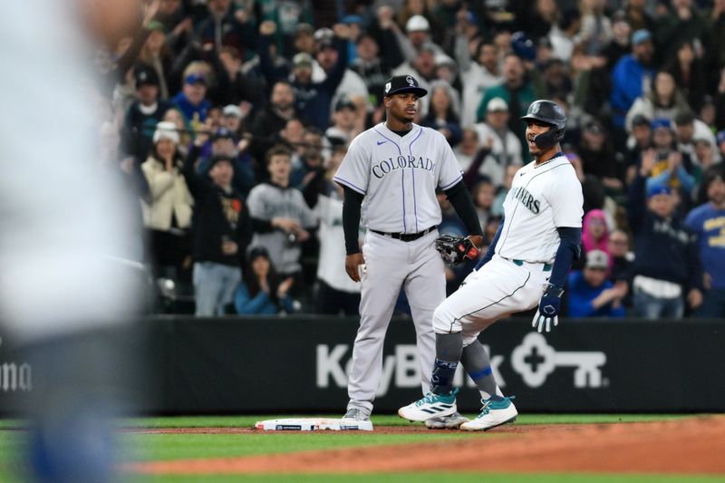 Apr 15, 2023; Seattle, Washington, USA; Seattle Mariners center fielder Julio Rodriguez (44) stops at third base after hitting a 3-RBI triple against the Colorado Rockies during the fourth inning at T-Mobile Park. Mandatory Credit: Steven Bisig-USA TODAY Sports