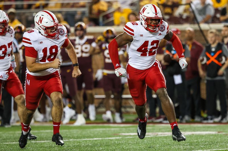 Aug 31, 2023; Minneapolis, Minnesota, USA; Nebraska Cornhuskers linebacker Eric Fields (42) celebrates a tackle against the Minnesota Golden Gophers during the third quarter at Huntington Bank Stadium. Mandatory Credit: Matt Krohn-USA TODAY Sports