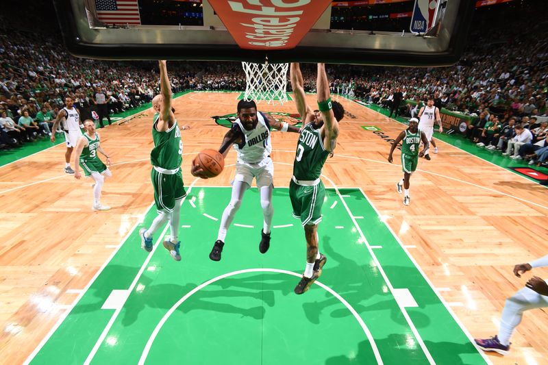 BOSTON, MA - JUNE 17: Kyrie Irving #11 of the Dallas Mavericks drives to the basket during the game against the Boston Celtics during Game 5 of the 2024 NBA Finals on June 17, 2024 at the TD Garden in Boston, Massachusetts. NOTE TO USER: User expressly acknowledges and agrees that, by downloading and or using this photograph, User is consenting to the terms and conditions of the Getty Images License Agreement. Mandatory Copyright Notice: Copyright 2024 NBAE  (Photo by Brian Babineau/NBAE via Getty Images)