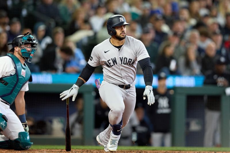 May 14, 2025; Seattle, Washington, USA; New York Yankees left fielder Jasson Dominguez (24) hits an RBI doube against the Seattle Mariners during the sixth inning at T-Mobile Park. Mandatory Credit: John Froschauer-Imagn Images
