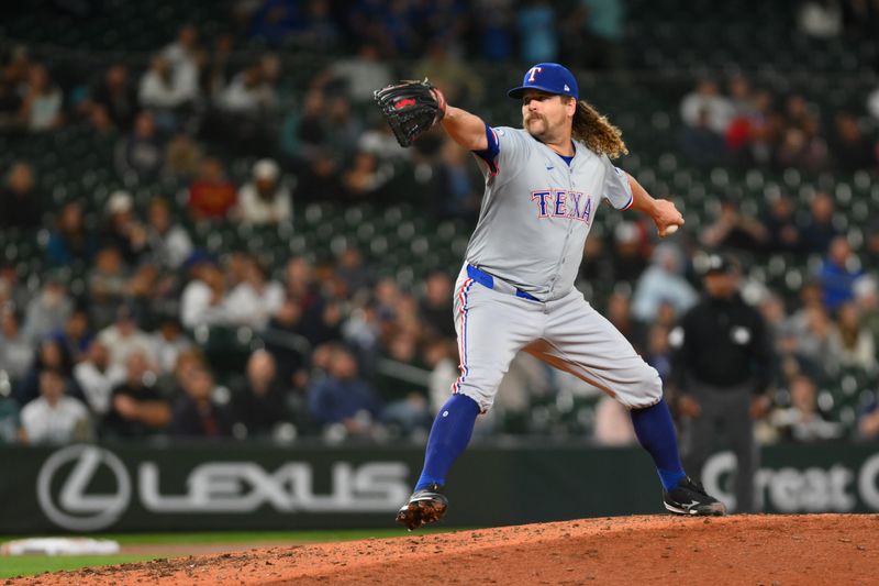 Sep 12, 2024; Seattle, Washington, USA; Texas Rangers relief pitcher Andrew Chafin (59) pitches to the Seattle Mariners during the fifth inning at T-Mobile Park. Mandatory Credit: Steven Bisig-Imagn Images