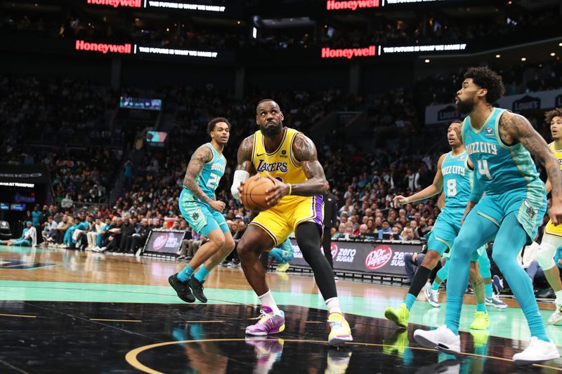 CHARLOTTE, NC - FEBRUARY 5: LeBron James #23 of the Los Angeles Lakers handles the ball during the game  against the Charlotte Hornets on February 5, 2024 at Spectrum Center in Charlotte, North Carolina. NOTE TO USER: User expressly acknowledges and agrees that, by downloading and or using this photograph, User is consenting to the terms and conditions of the Getty Images License Agreement.  Mandatory Copyright Notice:  Copyright 2024 NBAE (Photo by Brock Williams-Smith/NBAE via Getty Images)