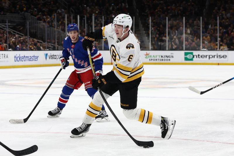 Jan 10, 2026; Boston, Massachusetts, USA; Boston Bruins defenseman Mason Lohrei (6) fires a shot as New York Rangers right wing Gabe Perreault (94) looks on during the first period at TD Garden. Mandatory Credit: Winslow Townson-Imagn Images