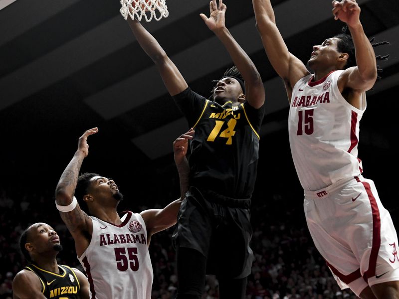 Jan 16, 2024; Tuscaloosa, Alabama, USA; Missouri guard Anthony Robinson II (14) goes to the basket between Alabama guard Aaron Estrada and Alabama forward Jarin Stevenson (15) in their game at Coleman Coliseum. Mandatory Credit: Gary Cosby Jr.-USA TODAY Sports