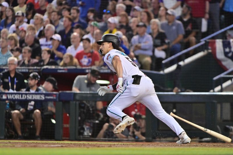 Nov 1, 2023; Phoenix, AZ, USA; Arizona Diamondbacks center fielder Alek Thomas (5) hits a single in the eighth inning against the Texas Rangers in game five of the 2023 World Series at Chase Field. Mandatory Credit: Matt Kartozian-USA TODAY Sports