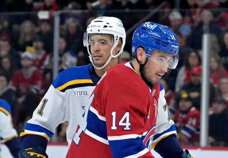 Oct 26, 2024; Montreal, Quebec, CAN; St.Louis Blues forward Mathieu Joseph (71) and Montreal Canadiens forward Nick Suzuki (14) during the second period at the Bell Centre. Mandatory Credit: Eric Bolte-Imagn Images