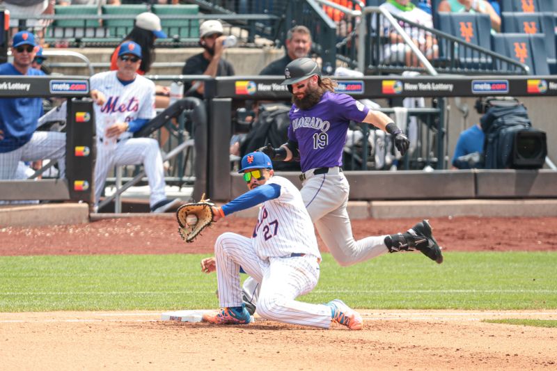 Jul 14, 2024; New York City, New York, USA; New York Mets third baseman Mark Vientos (27) catches a throw to force out Colorado Rockies designated hitter Charlie Blackmon (19) at first base during the fifth inning at Citi Field. Mandatory Credit: Vincent Carchietta-USA TODAY Sports