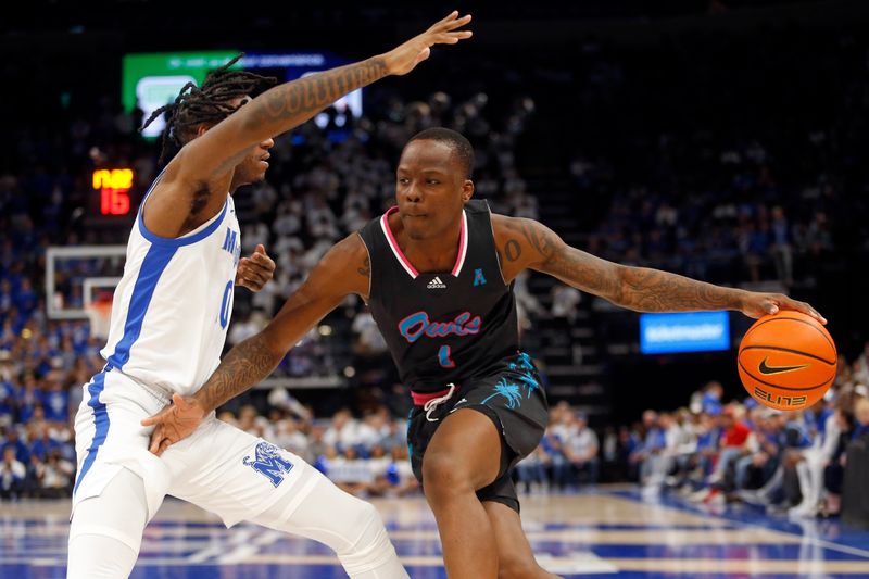 Feb 25, 2024; Memphis, Tennessee, USA; Florida Atlantic Owls guard Johnell Davis (1) drives to the basket as Memphis Tigers guard Jaykwon Walton (10) defends during the second half at FedExForum. Mandatory Credit: Petre Thomas-USA TODAY Sports