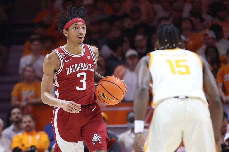 Feb 28, 2023; Knoxville, Tennessee, USA; Arkansas Razorbacks guard Nick Smith Jr. (3) brings the ball up court against Tennessee Volunteers guard Jahmai Mashack (15) during the first half at Thompson-Boling Arena. Mandatory Credit: Randy Sartin-USA TODAY Sports