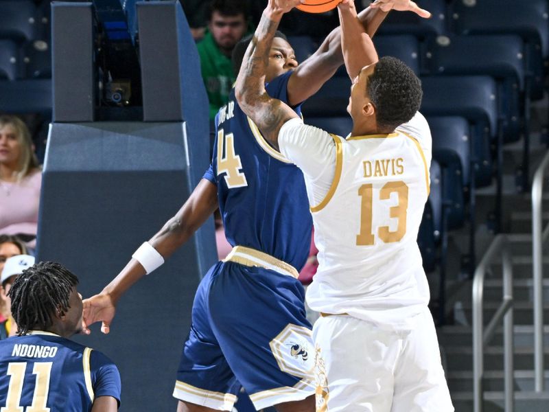 Feb 14, 2024; South Bend, Indiana, USA; Notre Dame Fighting Irish forward Tae Davis (13) goes up for a shot as Georgia Tech Yellow Jackets guard Kowacie Reeves, Jr. (14) defends in the first half at the Purcell Pavilion. Mandatory Credit: Matt Cashore-USA TODAY Sports