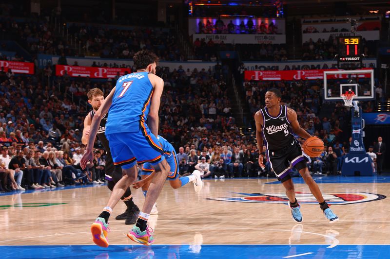 OKLAHOMA CITY, OK - APRIL 9: De'Aaron Fox #5 of the Sacramento Kings dribbles the ball during the game against the Oklahoma City Thunder  on April 9, 2024 at Paycom Arena in Oklahoma City, Oklahoma. NOTE TO USER: User expressly acknowledges and agrees that, by downloading and or using this photograph, User is consenting to the terms and conditions of the Getty Images License Agreement. Mandatory Copyright Notice: Copyright 2024 NBAE (Photo by Zach Beeker/NBAE via Getty Images)