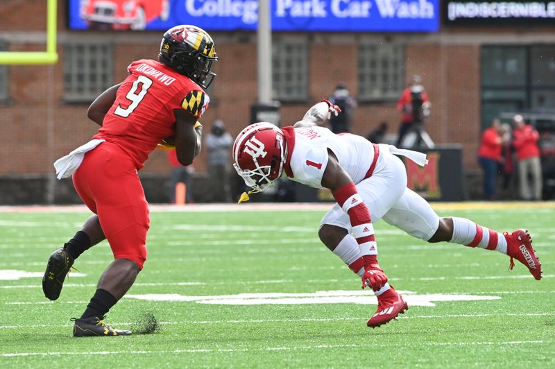 Oct 30, 2021; College Park, Maryland, USA;  Maryland Terrapins tight end Chigoziem Okonkwo (9) cuts in from tof Indiana Hoosiers defensive back Devon Matthews (1) during the first half at Capital One Field at Maryland Stadium. Mandatory Credit: Tommy Gilligan-USA TODAY Sports