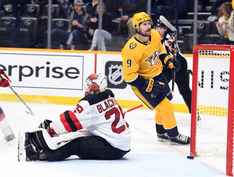 Jan 26, 2023; Nashville, Tennessee, USA; Nashville Predators left wing Filip Forsberg (9) celebrates after a goal against New Jersey Devils goaltender Mackenzie Blackwood (29) during the third period at Bridgestone Arena. Mandatory Credit: Christopher Hanewinckel-USA TODAY Sports