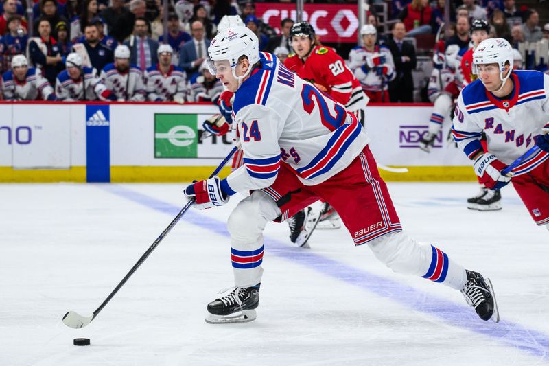 Feb 9, 2024; Chicago, Illinois, USA; New York Rangers right wing Kaapo Kakko (24) skates with the puck against the Chicago Blackhawks during the second period at the United Center. Mandatory Credit: Daniel Bartel-USA TODAY Sports