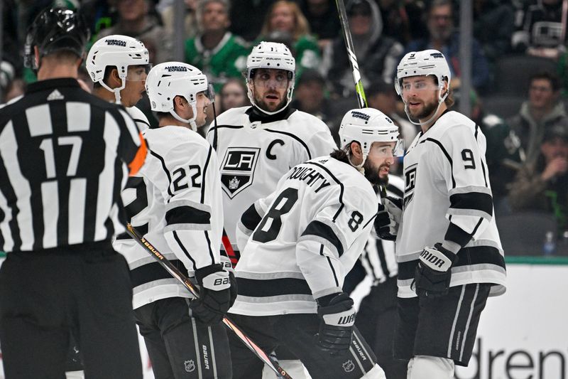 Jan 16, 2024; Dallas, Texas, USA; Los Angeles Kings right wing Quinton Byfield (55) and defenseman Drew Doughty (8) and left wing Kevin Fiala (22) and center Phillip Danault (24) and center Anze Kopitar (11) celebrates a power play goal scored by Doughty against the Dallas Stars during the second period at the American Airlines Center. Mandatory Credit: Jerome Miron-USA TODAY Sports