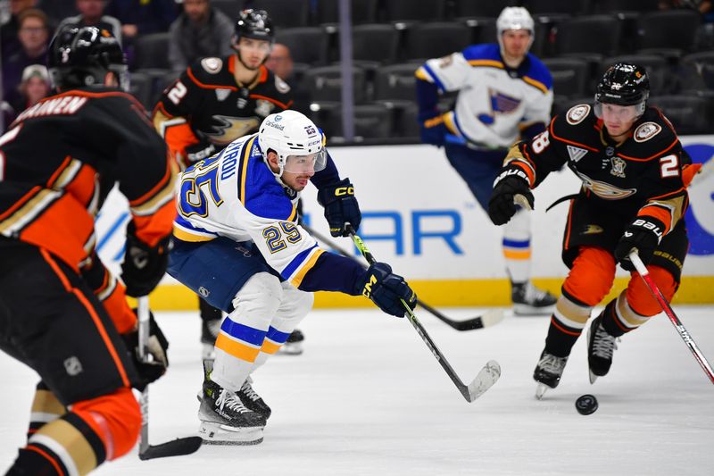 Apr 7, 2024; Anaheim, California, USA; St. Louis Blues center Jordan Kyrou (25) shoots on goal against the Anaheim Ducks during the third period at Honda Center. Mandatory Credit: Gary A. Vasquez-USA TODAY Sports