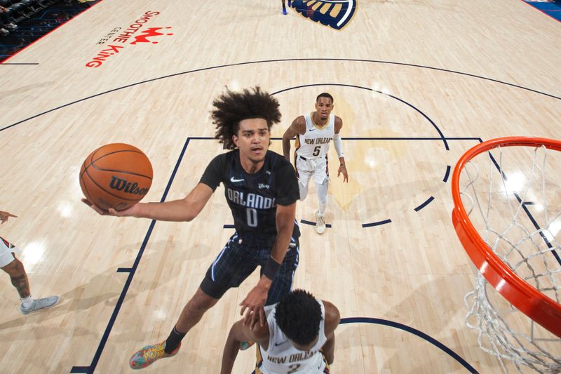 NEW ORLEANS, LA - OCTOBER 7: Anthony Black #0 of the Orlando Magic drives to the basket during the game against the New Orleans Pelicans on October 7, 2024 at the Smoothie King Center in New Orleans, Louisiana. NOTE TO USER: User expressly acknowledges and agrees that, by downloading and or using this Photograph, user is consenting to the terms and conditions of the Getty Images License Agreement. Mandatory Copyright Notice: Copyright 2024 NBAE (Photo by Layne Murdoch Jr./NBAE via Getty Images)