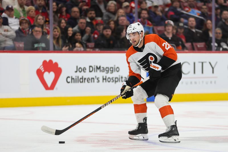 Feb 6, 2024; Sunrise, Florida, USA; Philadelphia Flyers defenseman Sean Walker (26) moves the puck against the Florida Panthers during the first period at Amerant Bank Arena. Mandatory Credit: Sam Navarro-USA TODAY Sports