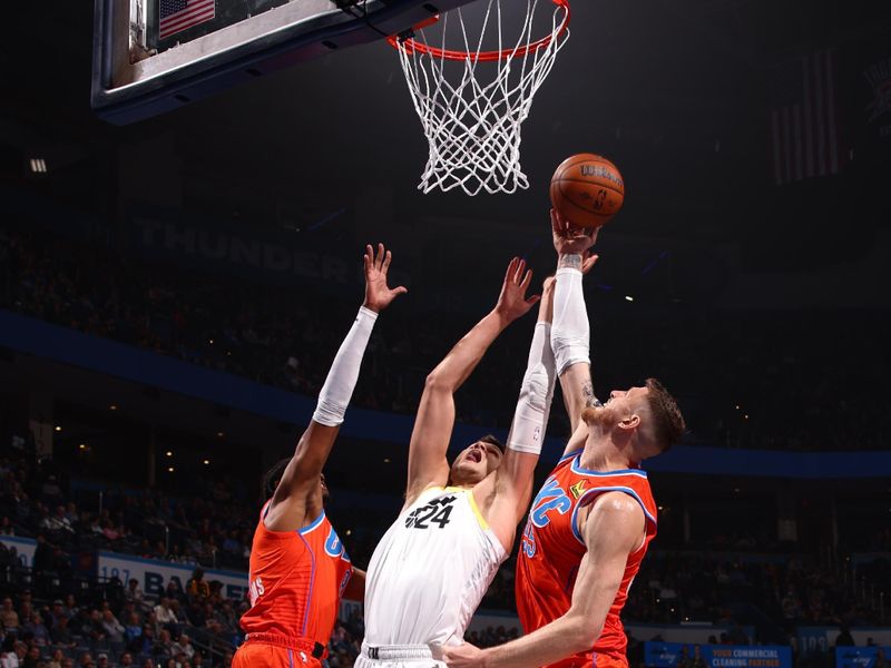 OKLAHOMA CITY, OK - DECEMBER 3: Isaiah Hartenstein #55 of the Oklahoma City Thunder grabs the rebound during the game against the Utah Jazz during the Emirates NBA Cup game on on December 3, 2024 at Paycom Center in Oklahoma City, Oklahoma. NOTE TO USER: User expressly acknowledges and agrees that, by downloading and or using this photograph, User is consenting to the terms and conditions of the Getty Images License Agreement. Mandatory Copyright Notice: Copyright 2024 NBAE (Photo by Zach Beeker/NBAE via Getty Images)