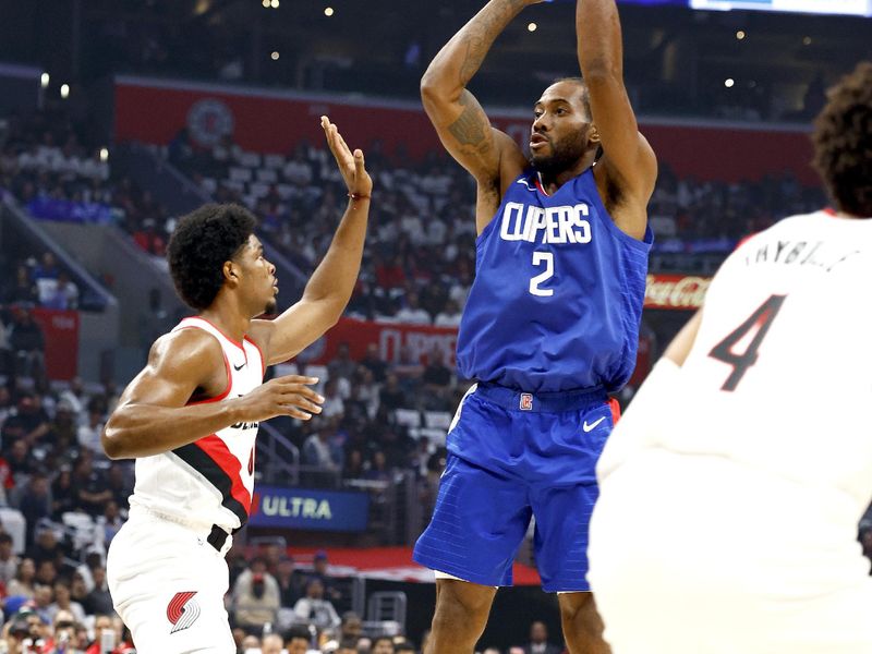 LOS ANGELES, CALIFORNIA - OCTOBER 25:  Kawhi Leonard #2 of the LA Clippers takes a shot against Scoot Henderson #00 of the Portland Trail Blazers in the first quarter at Crypto.com Arena on October 25, 2023 in Los Angeles, California.  NOTE TO USER: User expressly acknowledges and agrees that, by downloading and/or using this photograph, user is consenting to the terms and conditions of the Getty Images License Agreement. (Photo by Ronald Martinez/Getty Images)