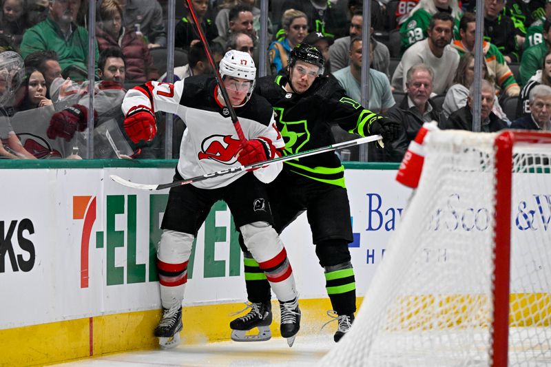 Mar 14, 2024; Dallas, Texas, USA; Dallas Stars center Logan Stankoven (11) checks New Jersey Devils defenseman Simon Nemec (17) during the second period at the American Airlines Center. Mandatory Credit: Jerome Miron-USA TODAY Sports