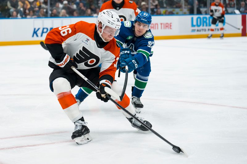 Dec 30, 2025; Vancouver, British Columbia, CAN; Vancouver Canucks forward Liam Ohgren (92) stick checks Philadelphia Flyers defenseman Emil Andrae (36) in the second period at Rogers Arena. Mandatory Credit: Bob Frid-Imagn Images