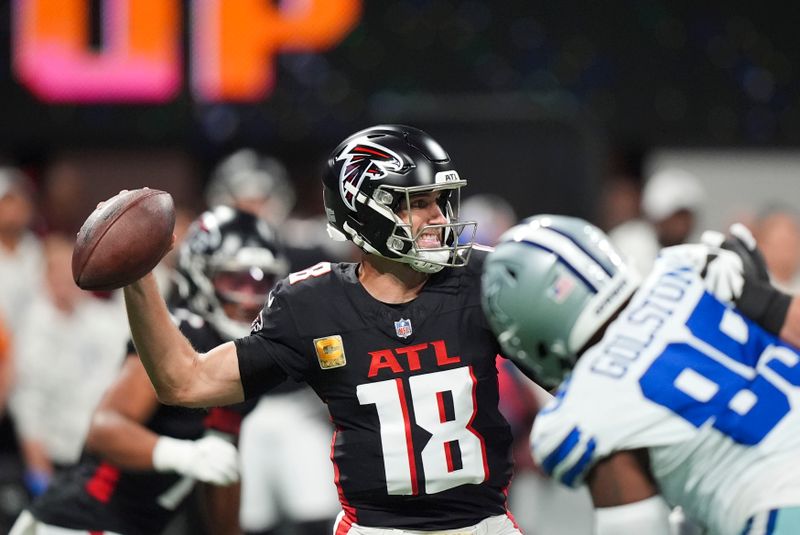 Atlanta Falcons quarterback Kirk Cousins (18) drops back to pass during the first half of an NFL football game against the Dallas Cowboys, Sunday, Nov. 3, 2024, in Atlanta. (AP Photo/ Brynn Anderson)