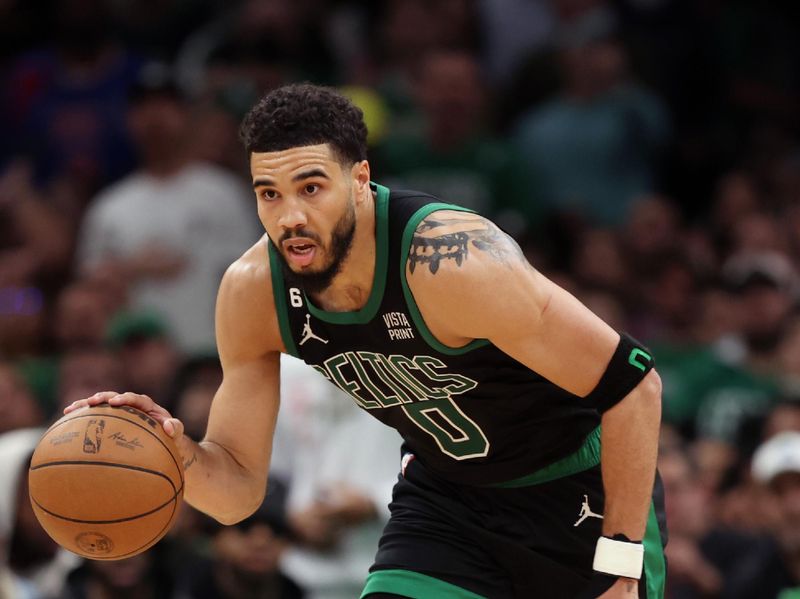 BOSTON, MASSACHUSETTS - MAY 01: Jayson Tatum #0 of the Boston Celtics dribbles against the Philadelphia 76ers during the second half in game one of the Eastern Conference Second Round Playoffs  at TD Garden on May 01, 2023 in Boston, Massachusetts. NOTE TO USER: User expressly acknowledges and agrees that, by downloading and or using this photograph, User is consenting to the terms and conditions of the Getty Images License Agreement.  (Photo by Maddie Meyer/Getty Images)