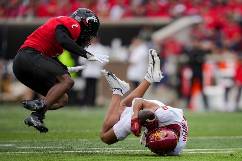 Oct 14, 2023; Cincinnati, Ohio, USA;  Iowa State Cyclones wide receiver Jayden Higgins (9) makes a catch against Cincinnati Bearcats cornerback Jordan Young (1) in the first half at Nippert Stadium. Mandatory Credit: Aaron Doster-USA TODAY Sports