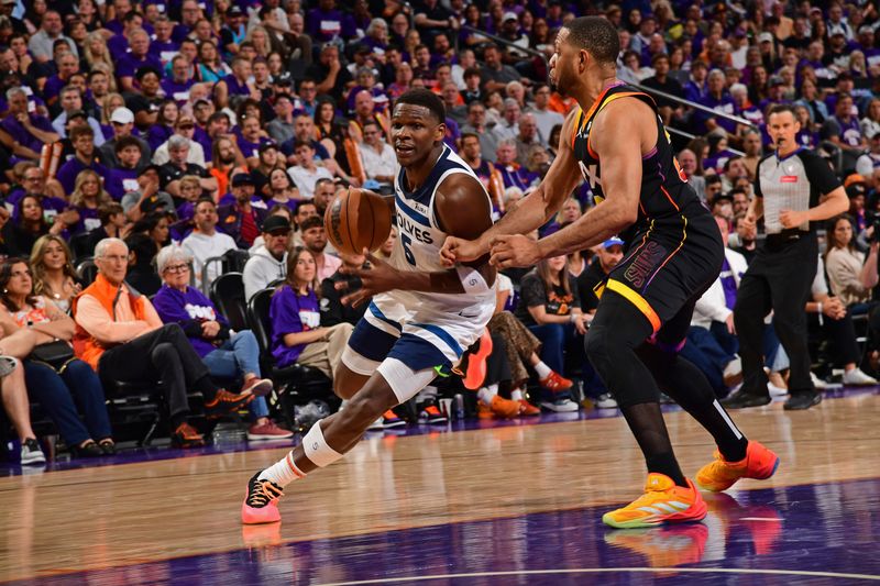 PHOENIX, AZ - APRIL  26: Anthony Edwards #5 of the Minnesota Timberwolves handles the ball during the game against the Phoenix Suns on April 26, 2024 at Footprint Center in Phoenix, Arizona. NOTE TO USER: User expressly acknowledges and agrees that, by downloading and or using this photograph, user is consenting to the terms and conditions of the Getty Images License Agreement. Mandatory Copyright Notice: Copyright 2024 NBAE (Photo by Kate Frese/NBAE via Getty Images)