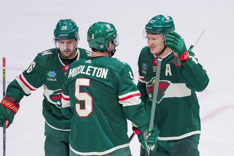 Mar 12, 2024; Saint Paul, Minnesota, USA; Minnesota Wild left wing Kirill Kaprizov (97) celebrates his goal with defenseman Jake Middleton (5) against the Arizona Coyotes in the third period at Xcel Energy Center. Mandatory Credit: Brad Rempel-USA TODAY Sports