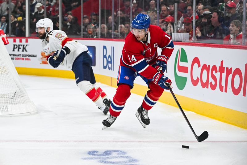 Mar 15, 2025; Montreal, Quebec, CAN; Montreal Canadiens center Nick Suzuki (14) plays the pouck against the Florida Panthers in the first period at Bell Centre. Mandatory Credit: David Kirouac-Imagn Images