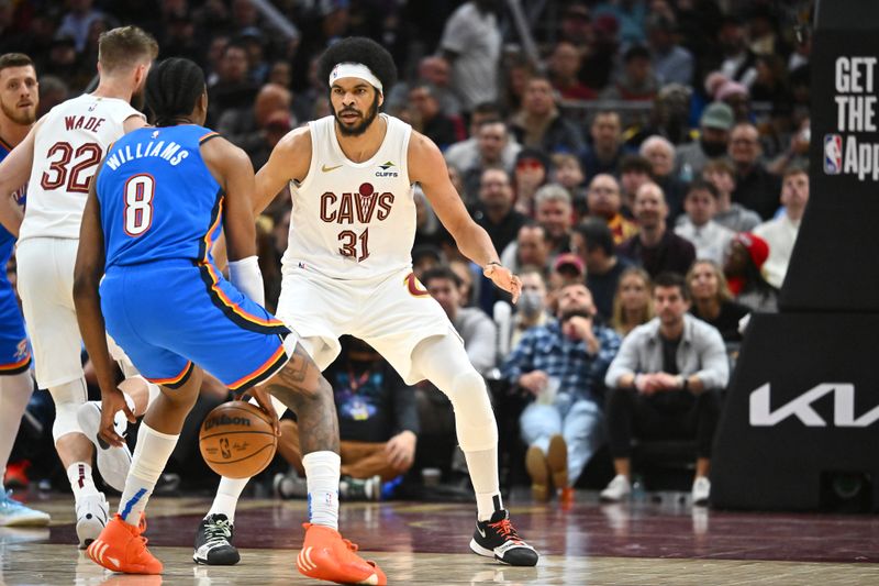 CLEVELAND, OHIO - JANUARY 08: Jarrett Allen #31 of the Cleveland Cavaliers guards Jalen Williams #8 of the Oklahoma City Thunder during the third quarter at Rocket Mortgage Fieldhouse on January 08, 2025 in Cleveland, Ohio. The Cavaliers defeated the Thunder 129-122. NOTE TO USER: User expressly acknowledges and agrees that, by downloading and or using this photograph, User is consenting to the terms and conditions of the Getty Images License Agreement. (Photo by Jason Miller/Getty Images)