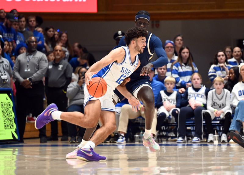 Dec 31, 2025; Durham, North Carolina, USA;Duke Blue Devils forward Cameron Boozer (12) drives to the basket as Georgia Tech Yellow Jackets center Mouhamed Sylia (6) defends during the first half at Cameron Indoor Stadium. Mandatory Credit: Rob Kinnan-Imagn Images