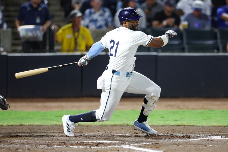Sep 15, 2025; Tampa, Florida, USA; Tampa Bay Rays first baseman Yandy Diaz (21) single against the Toronto Blue Jays in the sixth inning at George M. Steinbrenner Field. Mandatory Credit: Nathan Ray Seebeck-Imagn Images
