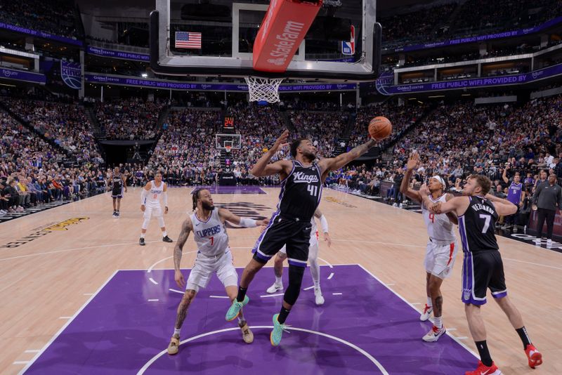 SACRAMENTO, CA - APRIL 2:  Trey Lyles #41 of the Sacramento Kings grabs the rebound during the game on April 2, 2024 at Golden 1 Center in Sacramento, California. NOTE TO USER: User expressly acknowledges and agrees that, by downloading and or using this Photograph, user is consenting to the terms and conditions of the Getty Images License Agreement. Mandatory Copyright Notice: Copyright 2024 NBAE (Photo by Rocky Widner/NBAE via Getty Images)