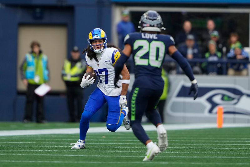 Los Angeles Rams wide receiver Puka Nacua (17) runs against Seattle Seahawks safety Julian Love (20) during the first half of an NFL football game in Seattle, Sunday, Nov. 3, 2024. (AP Photo/Lindsey Wasson)