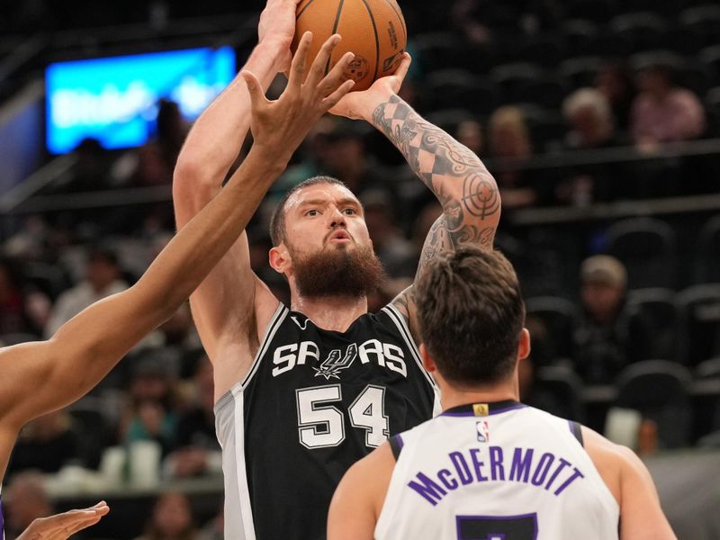 SAN ANTONIO, TX - DECEMBER 6: Sandro Mamukelashvili #54 of the San Antonio Spurs shoots the ball during the game against the Sacramento Kings on December 6, 2024 at the Frost Bank Center in San Antonio, Texas. NOTE TO USER: User expressly acknowledges and agrees that, by downloading and or using this photograph, user is consenting to the terms and conditions of the Getty Images License Agreement. Mandatory Copyright Notice: Copyright 2024 NBAE (Photos by Darren Carroll/NBAE via Getty Images)