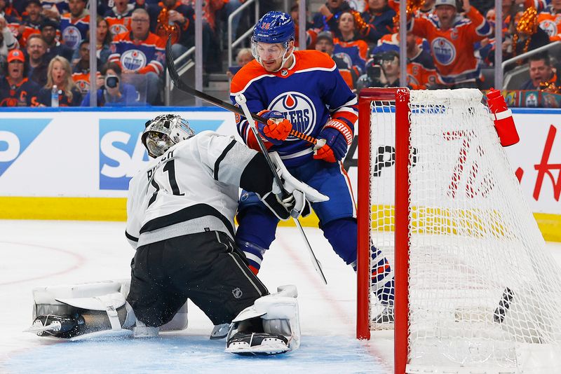 May 1, 2024; Edmonton, Alberta, CAN; Edmonton Oilers forward Zach Hyman (18) looks for a loose puck in front of Los Angeles Kings goaltender David Rittich (31) during the first period in game five of the first round of the 2024 Stanley Cup Playoffs at Rogers Place. Mandatory Credit: Perry Nelson-USA TODAY Sports