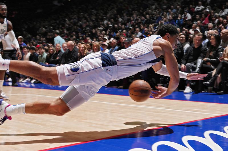 PHILADELPHIA, PA - FEBRUARY 5: Josh Green #8 of the Dallas Mavericks dives for loose ball during the game against the Philadelphia 76ers on February 5, 2024 at the Wells Fargo Center in Philadelphia, Pennsylvania NOTE TO USER: User expressly acknowledges and agrees that, by downloading and/or using this Photograph, user is consenting to the terms and conditions of the Getty Images License Agreement. Mandatory Copyright Notice: Copyright 2024 NBAE (Photo by Jesse D. Garrabrant/NBAE via Getty Images)