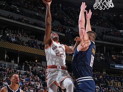 DENVER, CO - NOVEMBER 26: Malaki Branham #22 of the San Antonio Spurs drives to the basket during the game against the Denver Nuggets on November 26, 2023 at the Ball Arena in Denver, Colorado. NOTE TO USER: User expressly acknowledges and agrees that, by downloading and/or using this Photograph, user is consenting to the terms and conditions of the Getty Images License Agreement. Mandatory Copyright Notice: Copyright 2023 NBAE (Photo by Garrett Ellwood/NBAE via Getty Images)