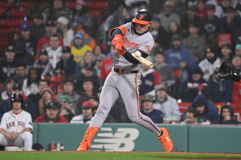 Apr 11, 20024; Boston, Massachusetts, USA; Baltimore Orioles shortstop Gunnar Henderson (2) hits a two run home run against the Boston Red Sox during the tenth inning at Fenway Park. Mandatory Credit: Eric Canha-USA TODAY Sports