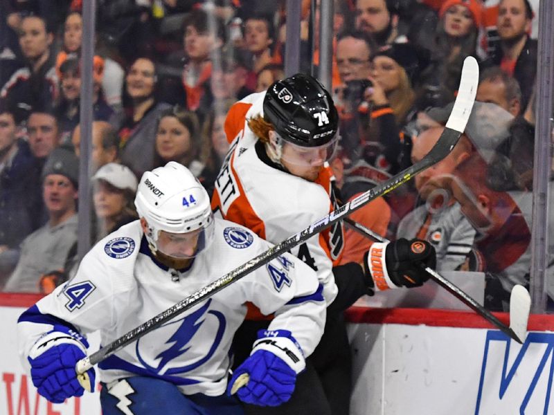 Feb 27, 2024; Philadelphia, Pennsylvania, USA; Tampa Bay Lightning defenseman Calvin de Haan (44) and Philadelphia Flyers right wing Owen Tippett (74) battle for the puck during the first period at Wells Fargo Center. Mandatory Credit: Eric Hartline-USA TODAY Sports