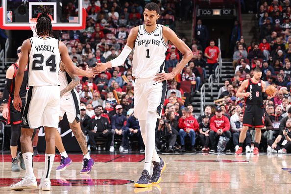 CHICAGO, IL - DECEMBER 21: Devin Vassell #24 and Victor Wembanyama #1 of the San Antonio Spurs high five during the game against the Chicago Bulls on December 21, 2023 at United Center in Chicago, Illinois. NOTE TO USER: User expressly acknowledges and agrees that, by downloading and or using this photograph, User is consenting to the terms and conditions of the Getty Images License Agreement. Mandatory Copyright Notice: Copyright 2023 NBAE (Photo by Jeff Haynes/NBAE via Getty Images)