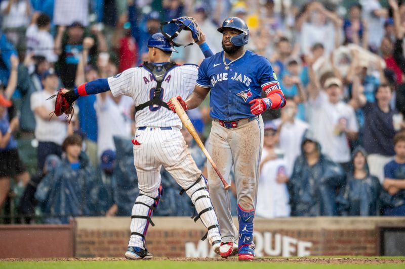 Aug 17, 2024; Chicago, Illinois, USA; Toronto Blue Jays first base Vladimir Guerrero Jr. (27) reacts after striking out to end the game against the Chicago Cubs at Wrigley Field. Mandatory Credit: Patrick Gorski-USA TODAY Sports