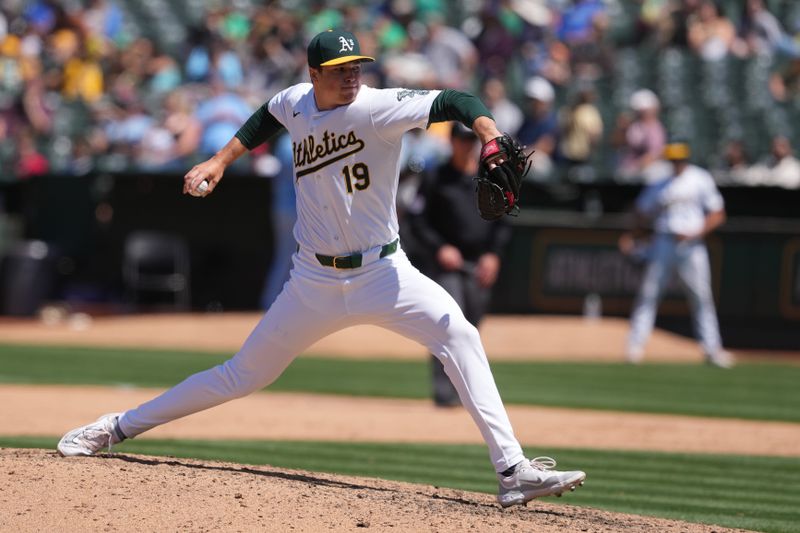 Jun 9, 2024; Oakland, California, USA; Oakland Athletics relief pitcher Mason Miller (19) throws a pitch against the Toronto Blue Jays during the ninth inning at Oakland-Alameda County Coliseum. Mandatory Credit: Darren Yamashita-USA TODAY Sports