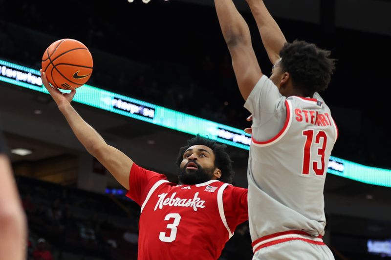 Mar 4, 2025; Columbus, Ohio, USA;  Nebraska Cornhuskers guard Brice Williams (3) drives to the basket as Ohio State Buckeyes forward Sean Stewart (13) defends during the first half at Value City Arena. Mandatory Credit: Joseph Maiorana-Imagn Images