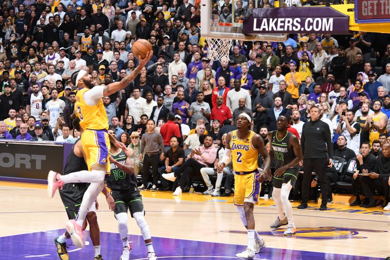 LOS ANGELES, CA - APRIL 11: Anthony Davis #3 of the Los Angeles Lakers drives to the basket against the Minnesota Timberwolves during the 2023 Play-In Tournament on April 11, 2023 at Crypto.Com Arena in Los Angeles, California. NOTE TO USER: User expressly acknowledges and agrees that, by downloading and/or using this Photograph, user is consenting to the terms and conditions of the Getty Images License Agreement. Mandatory Copyright Notice: Copyright 2023 NBAE (Photo by Andrew D. Bernstein/NBAE via Getty Images)