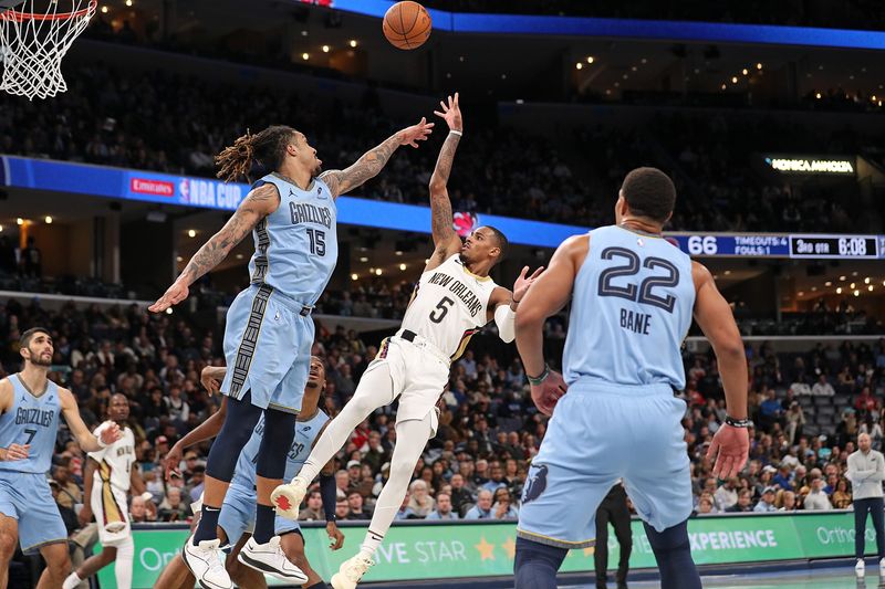 MEMPHIS, TENNESSEE - NOVEMBER 29: Dejounte Murray #5 of the New Orleans Pelicans shoots against Brandon Clarke #15 of the Memphis Grizzlies during the second half of an Emirates NBA Cup game at FedExForum on November 29, 2024 in Memphis, Tennessee. NOTE TO USER: User expressly acknowledges and agrees that, by downloading and or using this photograph, User is consenting to the terms and conditions of the Getty Images License Agreement. (Photo by Justin Ford/Getty Images)